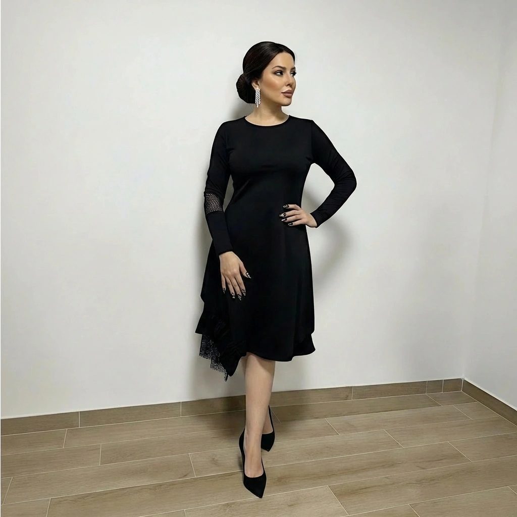 Minimalistička crna haljina s asimetričnim rubom, laganim padom i suptilnim mrežastim detaljem na rukavu. Dizajnirana za svakodnevnu eleganciju bez kompromisa.